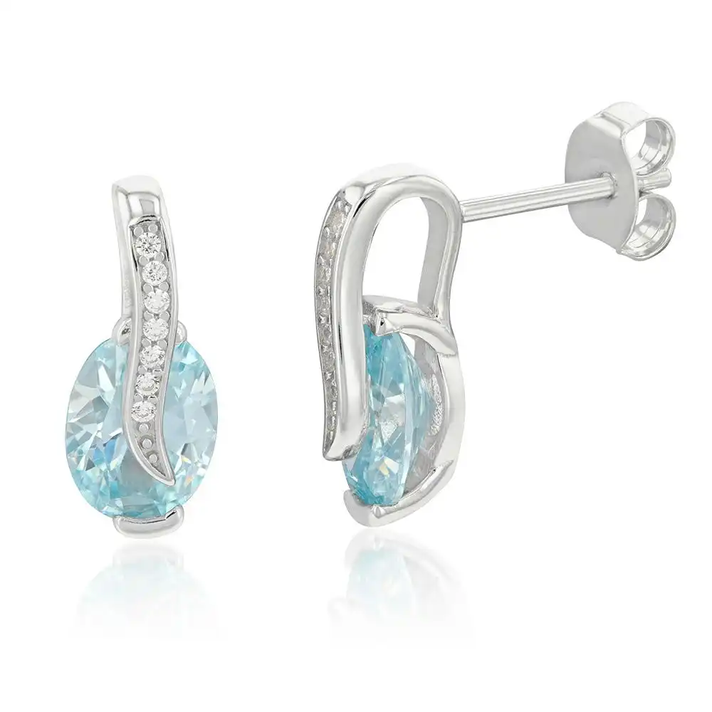 Sterling Silver Rhodium Plated Light Blue And White CZ Crossover Stud Earrings